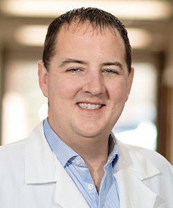 Dr. Gabriel Anders in a white coat