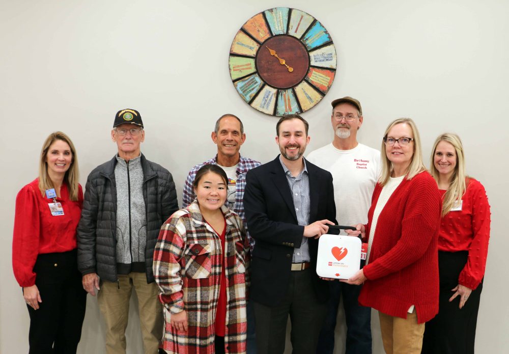 Bethany Baptist Church received an AED from the Bothwell Foundation’s Wear Red for Women committee. Back row, from left to right, Lesley Jackson, committee member; Wayne Tucker, Church Safety Team; Marty Holdeman, Church Deacon; Scot Schultz, Church Safety Chairman; and Lauren Thiel-Payne, Bothwell Foundation executive director; front row, from left to right, Leisha Nakagawa, Bothwell Foundation specialist and volunteer coordinator; Travis Battershell, Church Pastor; and Dianne Simon, Thompson Hills Investment Corporation vice president and Wear Red Committee co-chair.