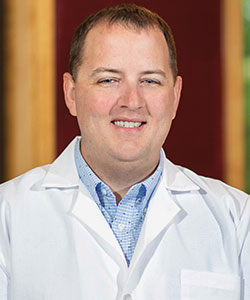 Dr. Gabriel Anders in a white coat