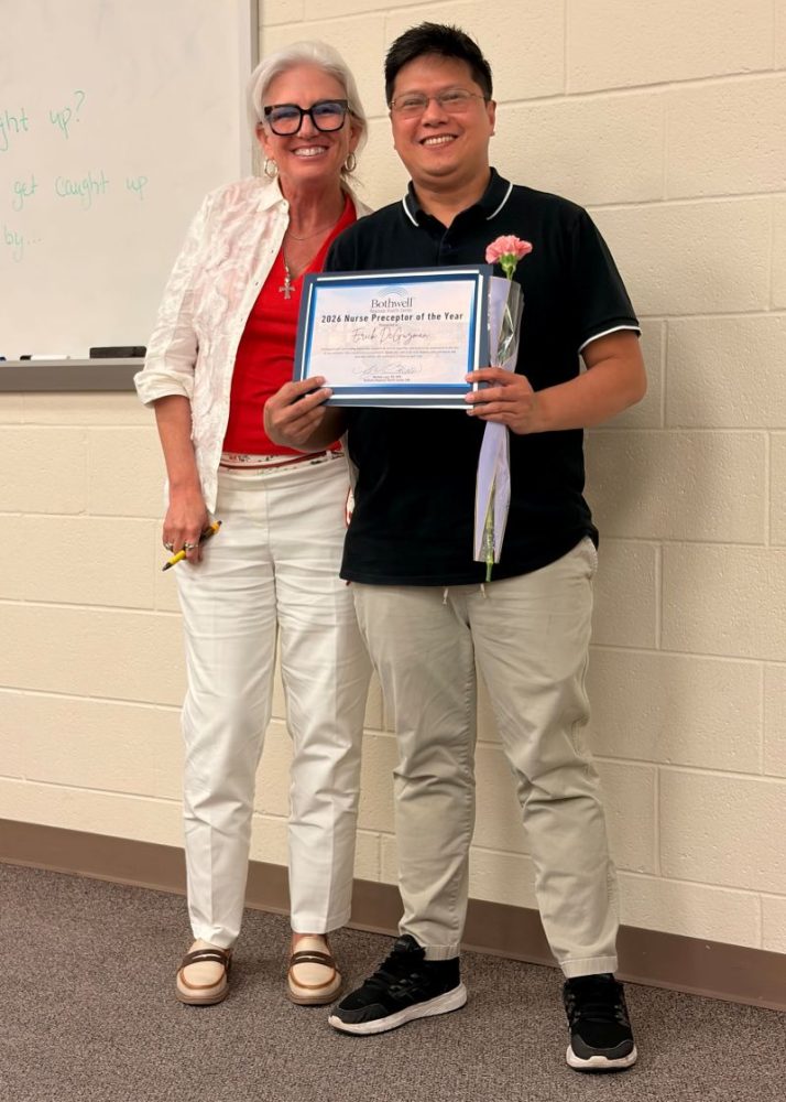 Erick DeGuzman, right, Bothwell's 2026 Nurse Preceptor of the Year, is pictured with Chief Nursing Officer Michele Laas during Bothwell Regional Health Center's National Nurses Week award ceremony.