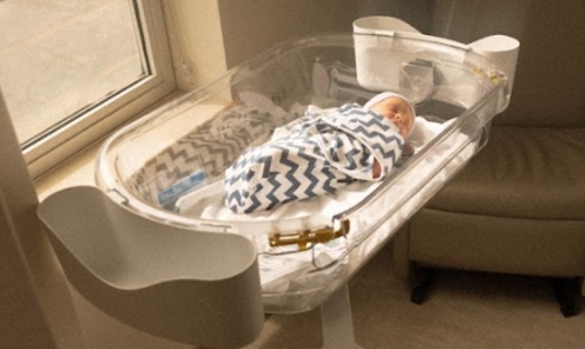 Graham Payne, Lauren Thiel-Payne’s son, was the first baby to use Bothwell’s new HALO BassiNest bassinet, a 360-degree swivel baby sleeper that is designed to keep baby safe and closer to mom in a postpartum room. Photo by Mallard Photography