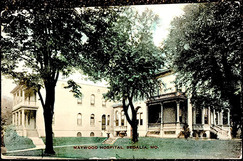 The front of a postcard of Maywood Hospital from 1908