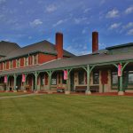 A view of the Katy Depot from the front lawn on a slightly cloudy day