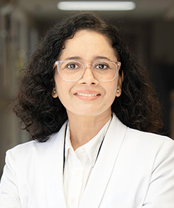 Dr. Choudhary professional photo in a white coat