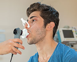 Man receiving respiratory care in Bothwell hospital respiratory care unit