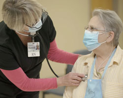 Provider treating patient in the cardiac and pulmonary rehabilitation unit