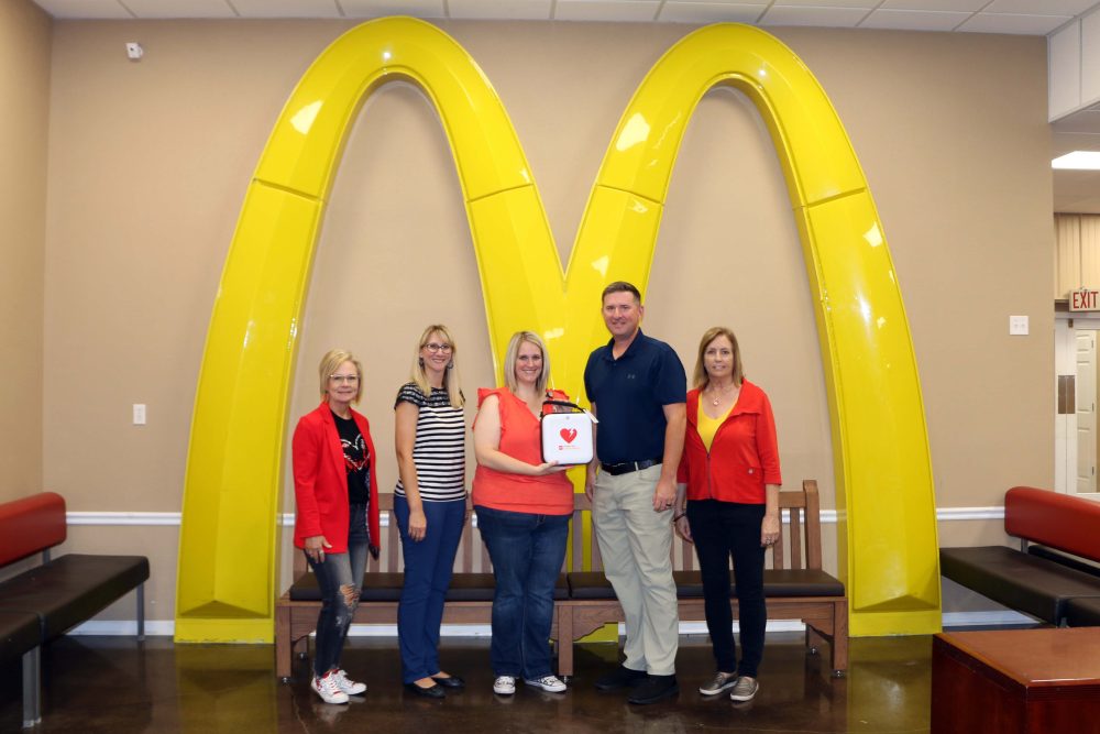 From left, Trish Henson and Erica Petersen; committee members; Lauren Thiel-Payne, Bothwell Foundation executive director; Chuck Marshall, McDonald’s owner/operator; and Robin Balke, committee member.