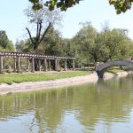 Sedalia Liberty Park pond and bridge on a sunny day